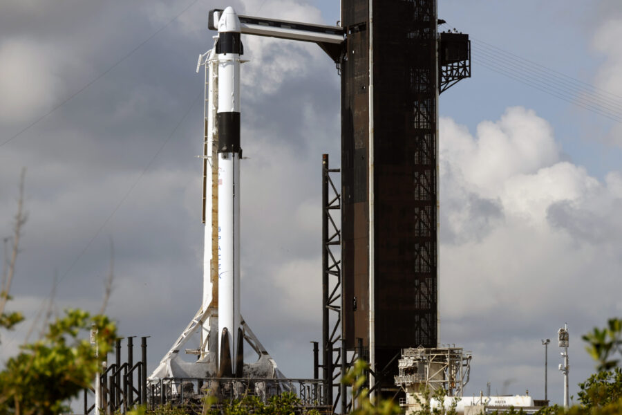 A SpaceX Falcon 9 rocket, with the Crew Dragon spacecraft, stands ready for launch to the Internati...