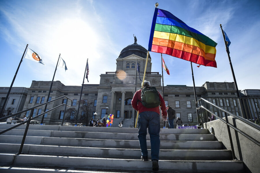 FILE - Demonstrators gather on the steps of the Montana state Capitol protesting anti-LGBTQ+ legisl...