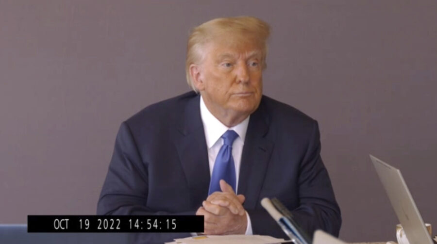 In this image taken from video released by Kaplan Hecker & Fink, former President Donald pauses...