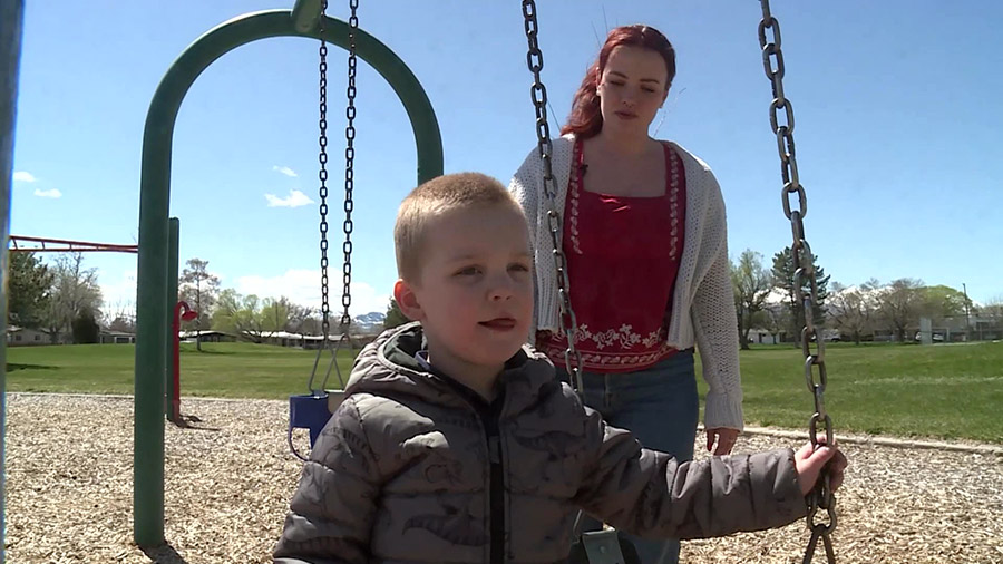 Jaxxon playing in the park with his case worker, Isabelle Adams. (KSLTV)...