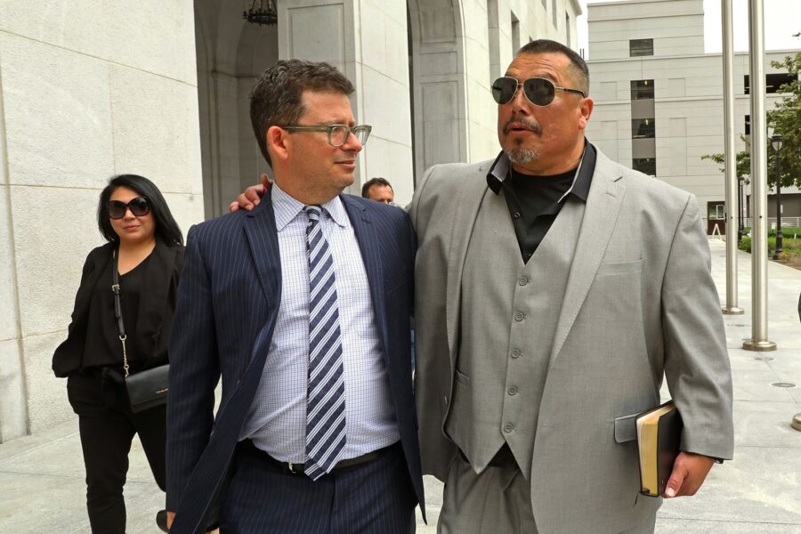 Daniel Saldana, right, leaves the Los Angeles Hall of Justice with his attorney Mike Romano on Thur...