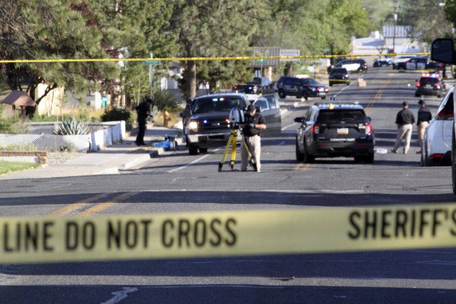 Investigators in Farmington, New Mexico, work Monday on a residential street after the shooting.
Ma...