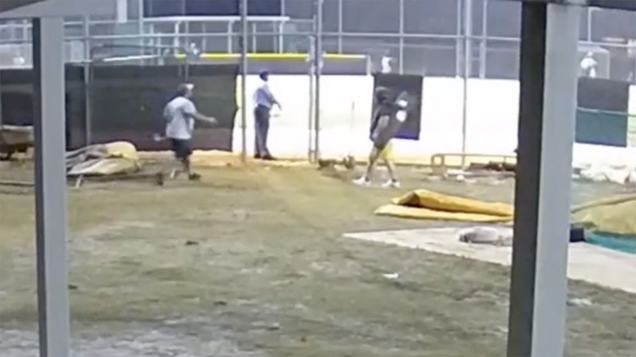 A man approaches an umpire at a Florida high school game, video show. (Osceola County Sheriff's Off...