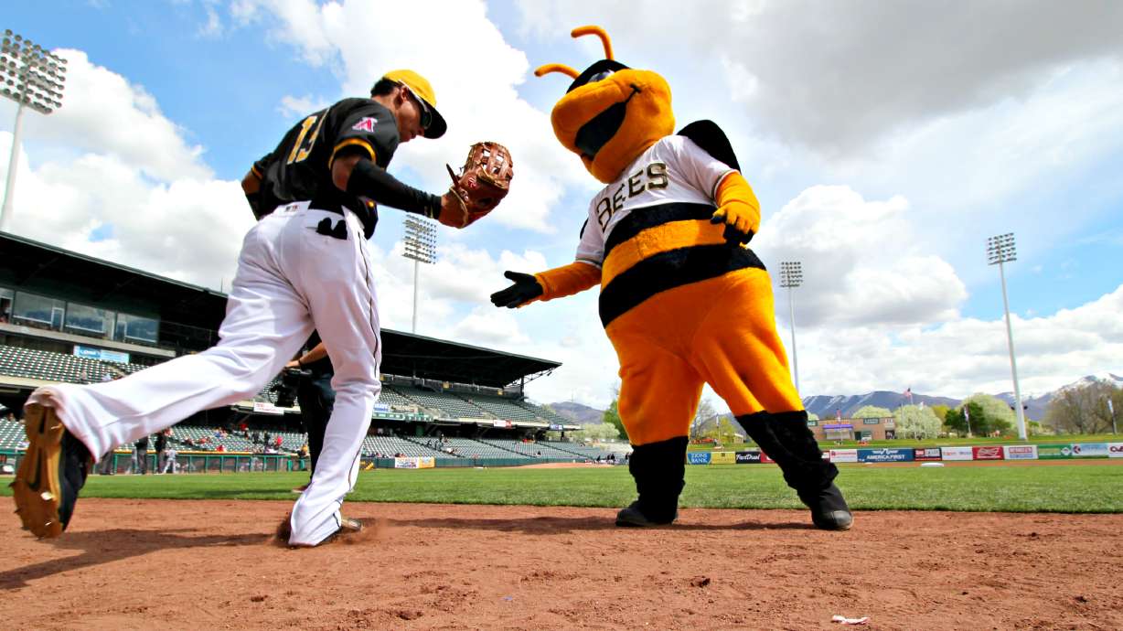 Salt Lake Bees mascot Bumble with Bees outfielder Quintin Berry on April 10, 2016.  The new Daybrea...
