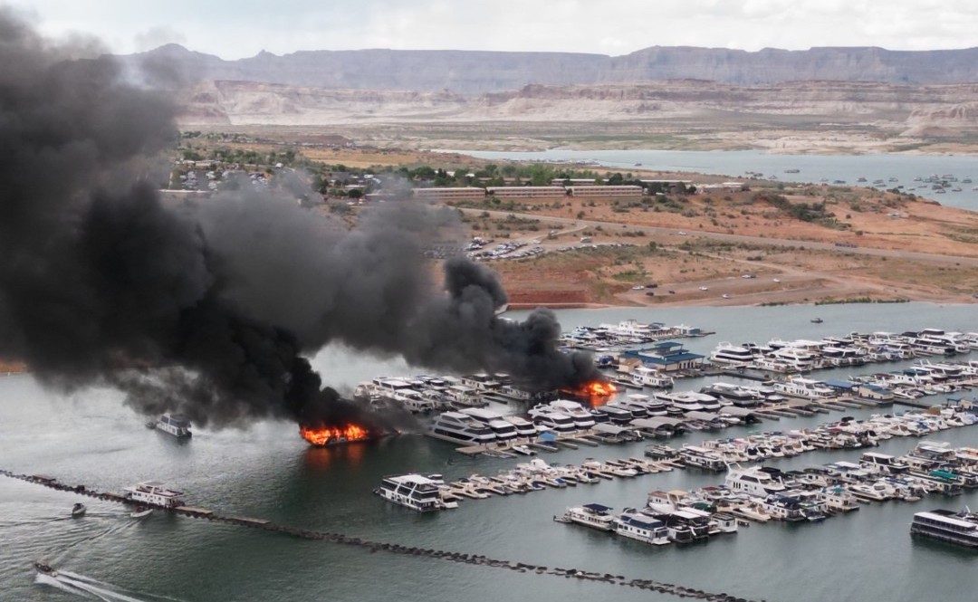Houseboats on fire at Lake Powell on June 2. Large black plumes of smoke fill the air...