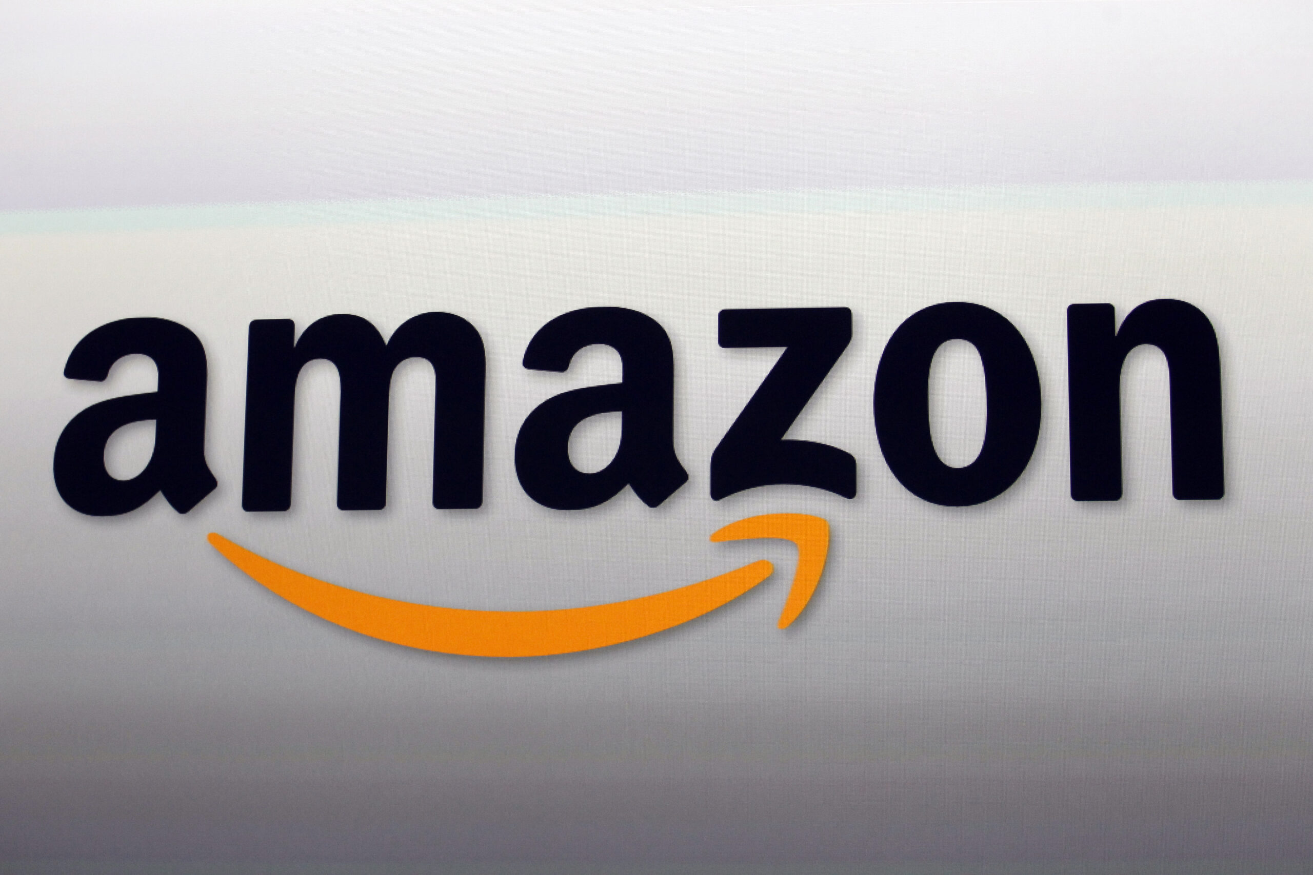 FILE - The Amazon logo is displayed, Sept. 6, 2012, in Santa Monica, Calif. Amazon's profitable clo...