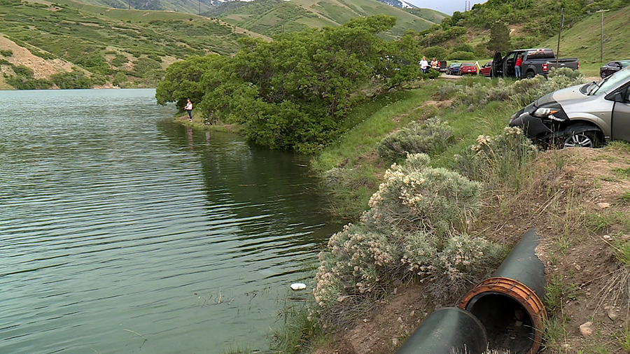 Minivan on the bank above a reservoir...