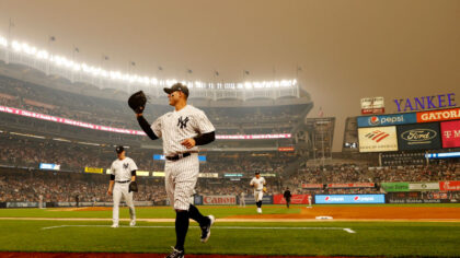 General view of hazy conditions resulting from smoke from Canadian wildfires as Anthony Rizzo #48 of the New York Yankees jogs to the dugout during the second inning against the Chicago White Sox at Yankee Stadium on June 06, 2023 in the Bronx borough of New York City.