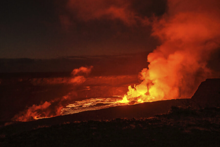 In this photo provided by the National Park Service lava spews from the Kilauea volcano in Hawaii, ...