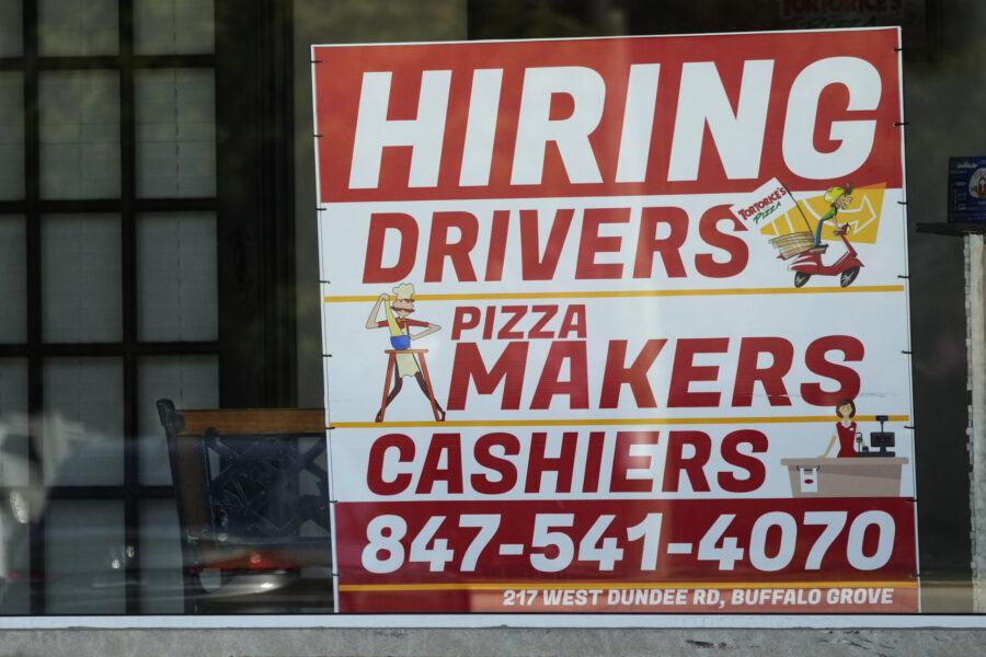 A hiring sign is displayed at a restaurant in Buffalo Grove, Ill., Wednesday, May 10, 2023. On Wedn...