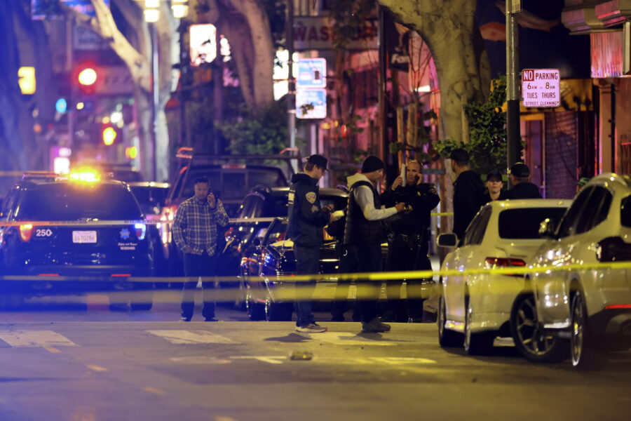 Police secure and investigate the scene of a shooting in San Francisco on Friday, June 9, 2023. Mul...