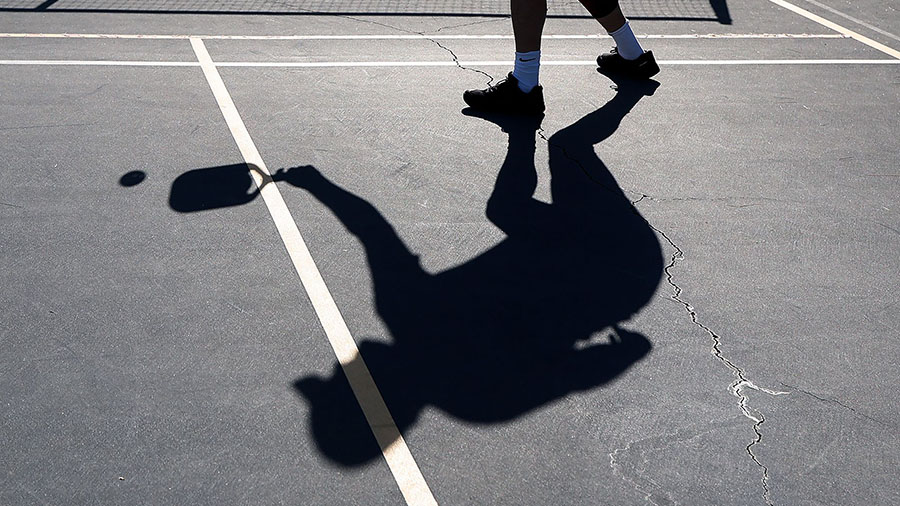 A player's shadow is seen during a game of pickleball on April 12, in Bethesda, Maryland. (Kevin Di...