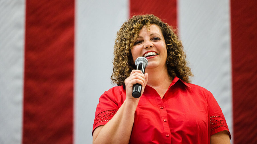 Woman in a red shirt, candidate Celeste Maloy...