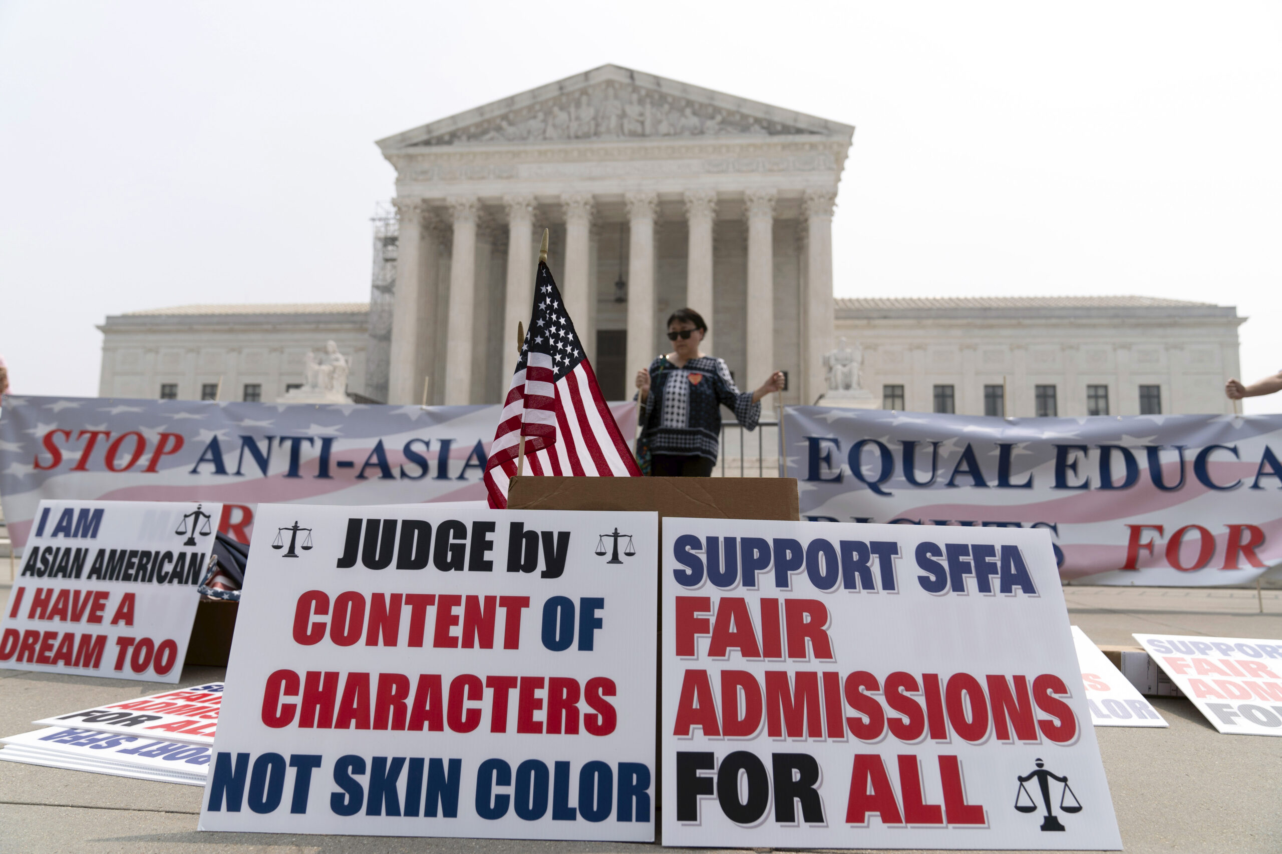 A person protests outside of the Supreme Court in Washington, Thursday, June 29, 2023. The Supreme ...