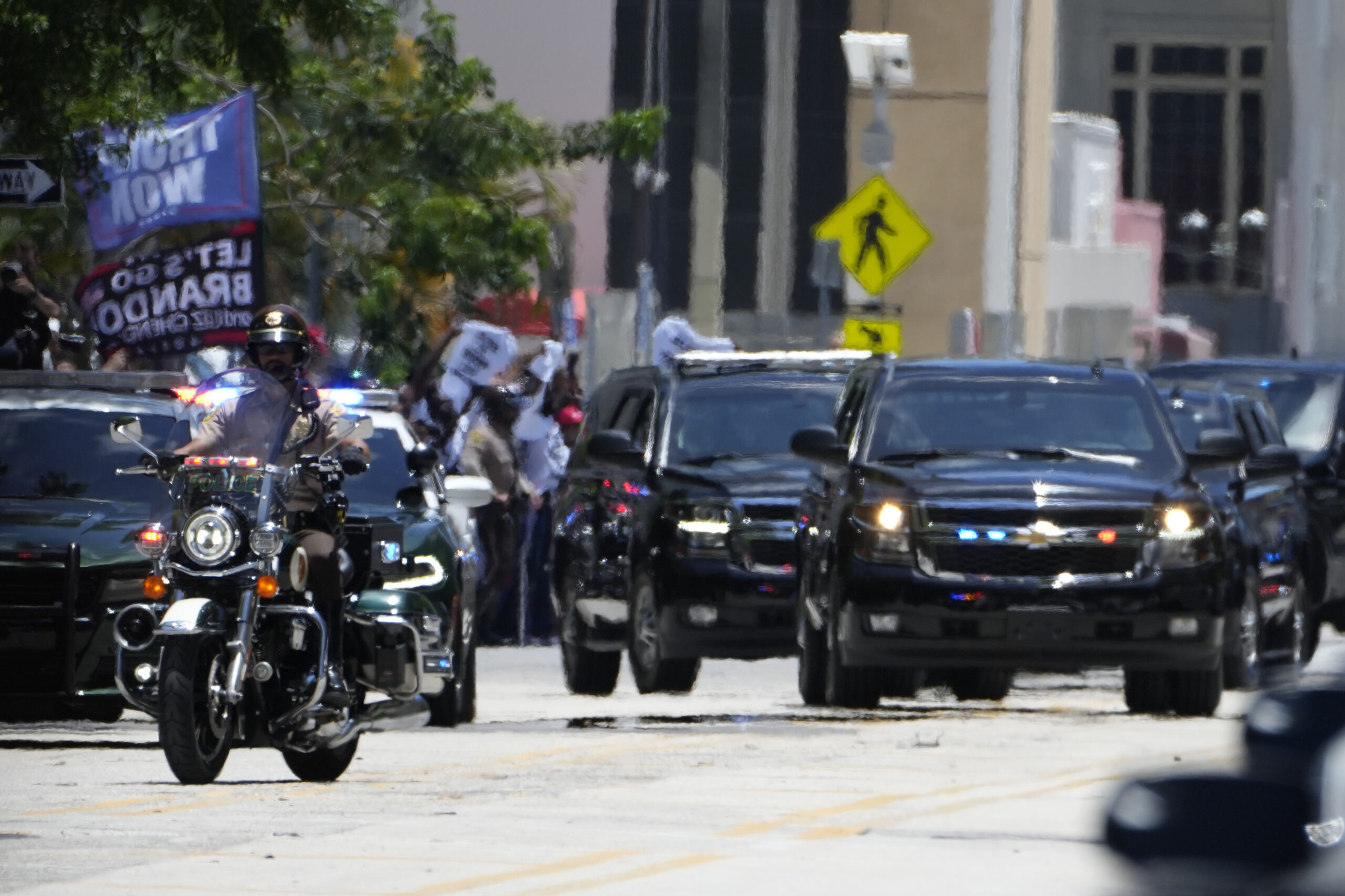 The motorcade carrying former President Donald Trump arrives near the Wilkie D. Ferguson Jr. U.S. C...