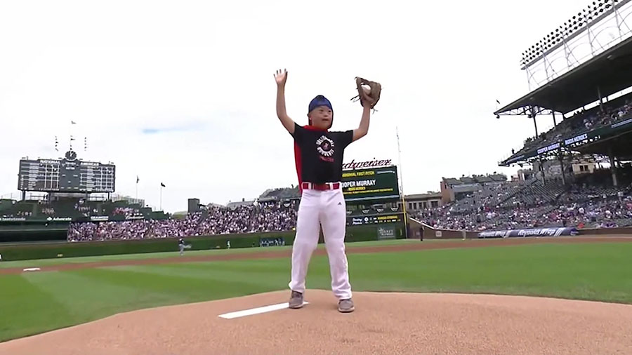 11-year-old Cooper Murray throwing the first pitch at a Red Sox game....