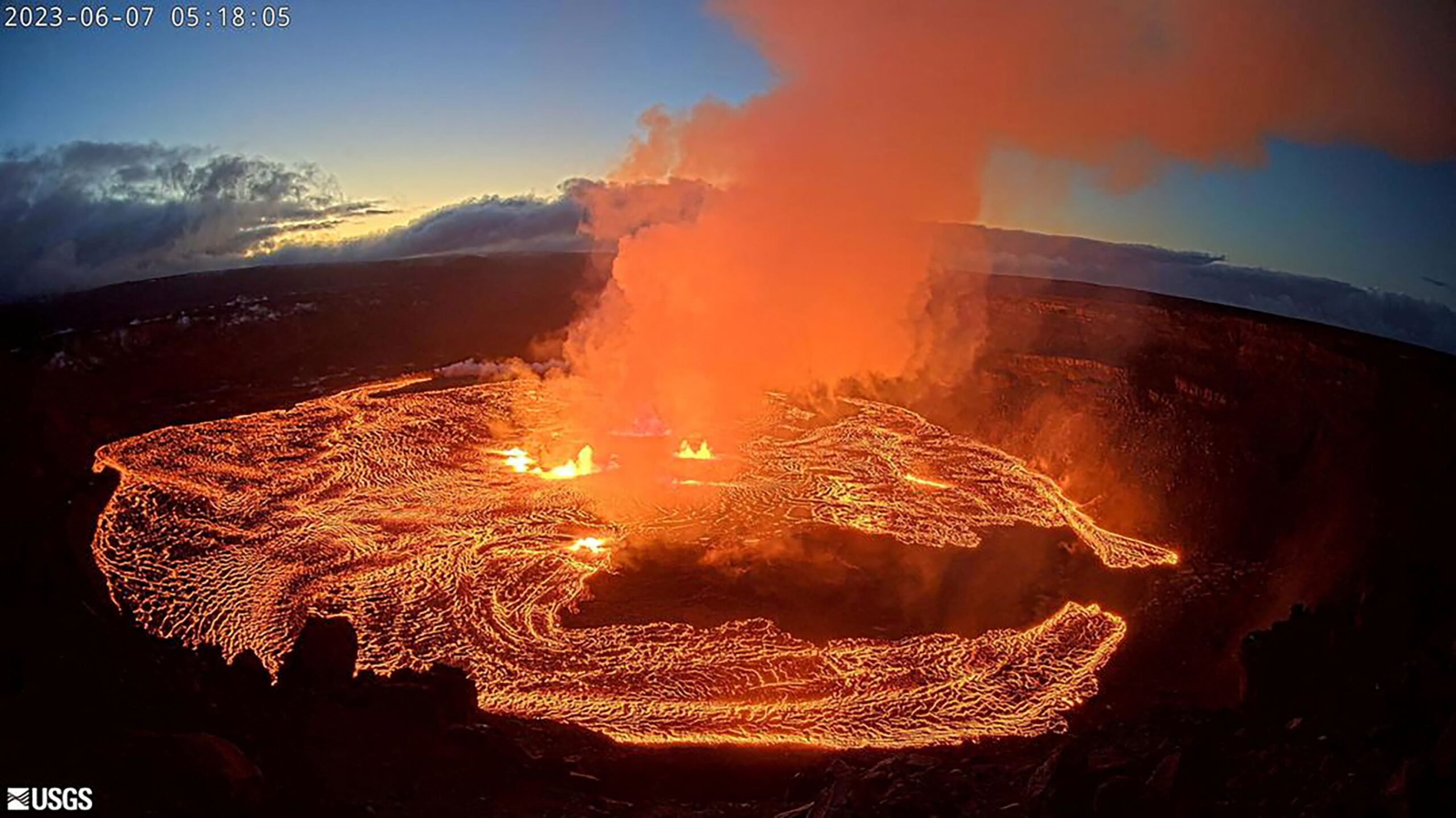 A lava lake forms at Halemaʻumaʻu as seen from the west rim of the Kilauea caldera during the vol...