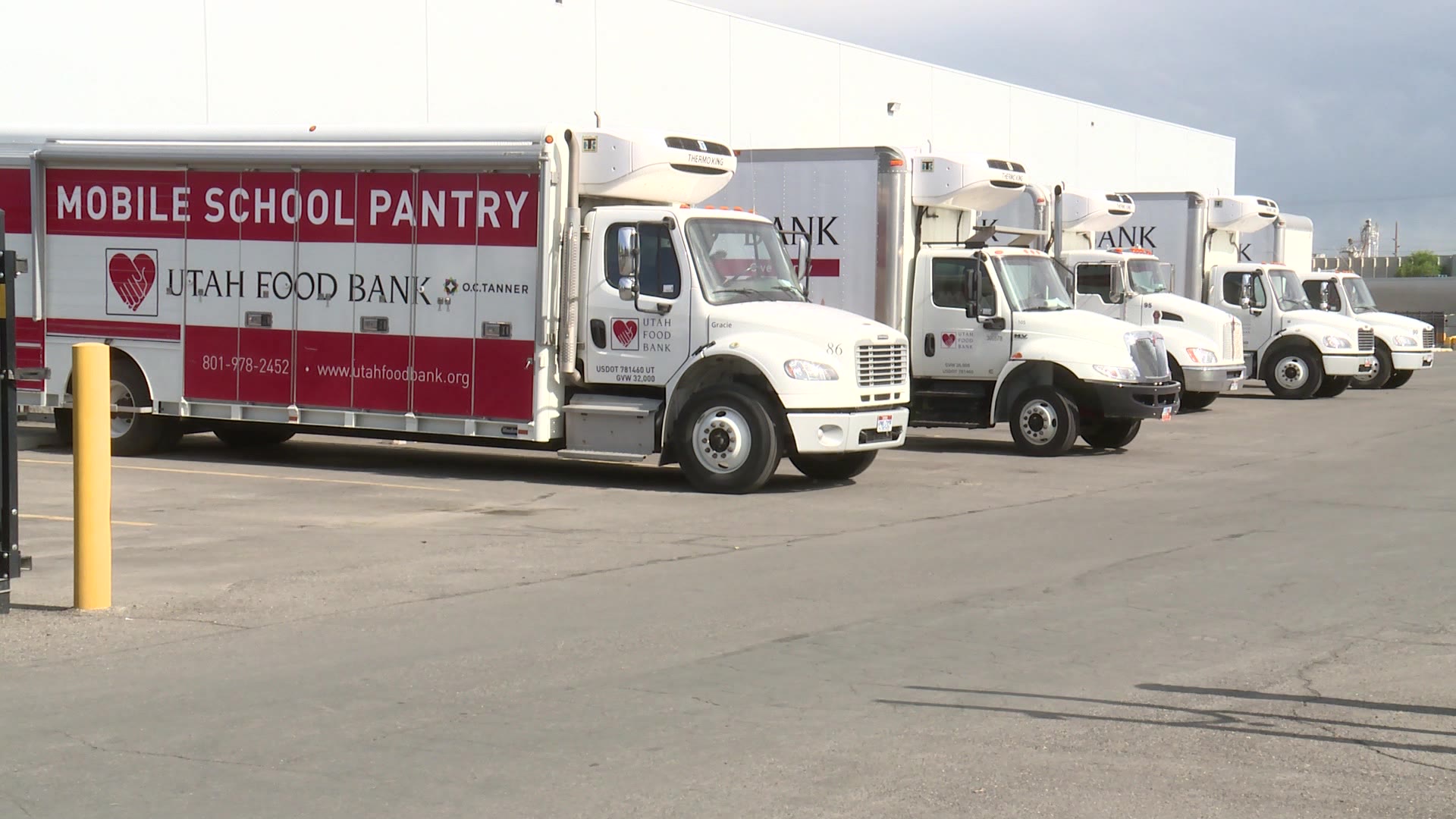 Utah Food Bank trucks backed up to a building ahead of its free summer lunch program for Utah kids....