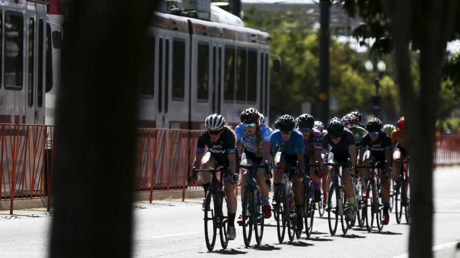Riders in the women's category race down 200 South during the Salt Lake Criterium at The Gateway in...