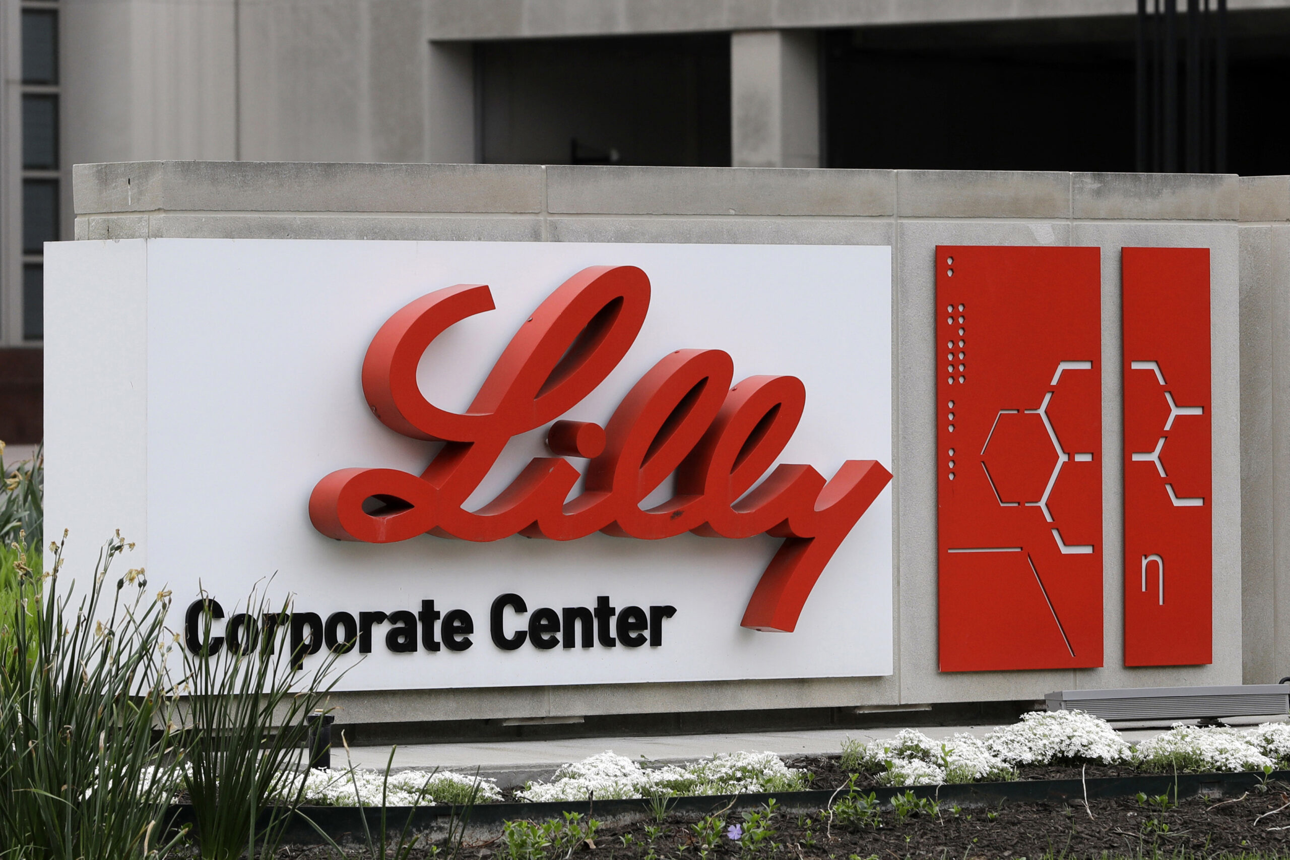 FILE - A sign for Eli Lilly & Co. stands outside their corporate headquarters in Indianapolis on Ap...