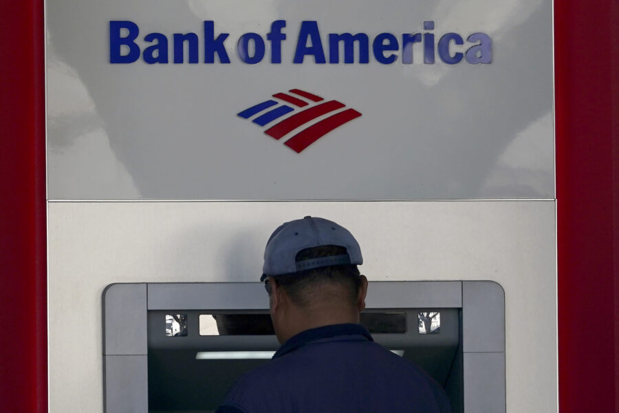 File - A customer uses an ATM at a Bank of America location in San Francisco, Monday, April 24, 202...
