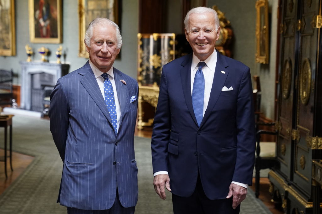 King Charles III and US President Joe Biden pose in the Grand Corridor at Windsor Castle on July 10...