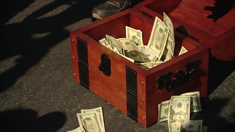 A treasure chest filled with $20,000 is pictured during a press conference in the Best Buy parking ...