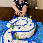 Kaden Alcantara touches his cake on his second birthday. (Jennifer Lopez)