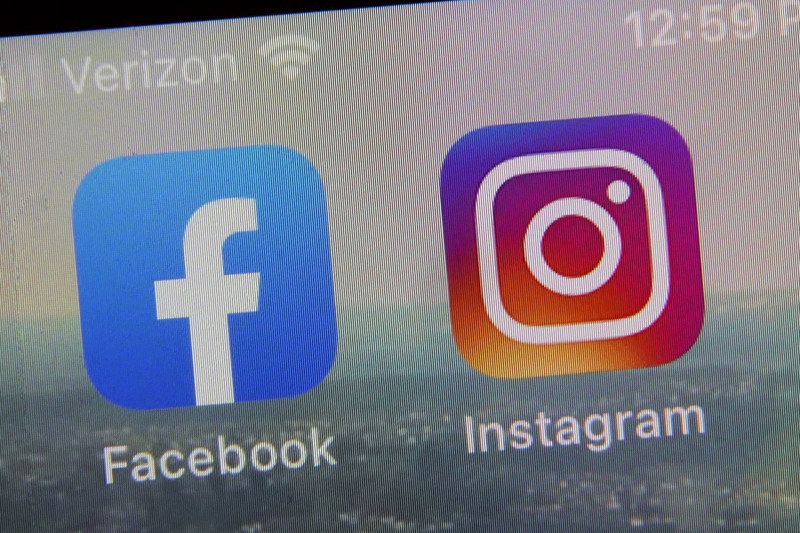 FILE - This photo shows the mobile phone app logos for, from left, Facebook and Instagram in New Yo...