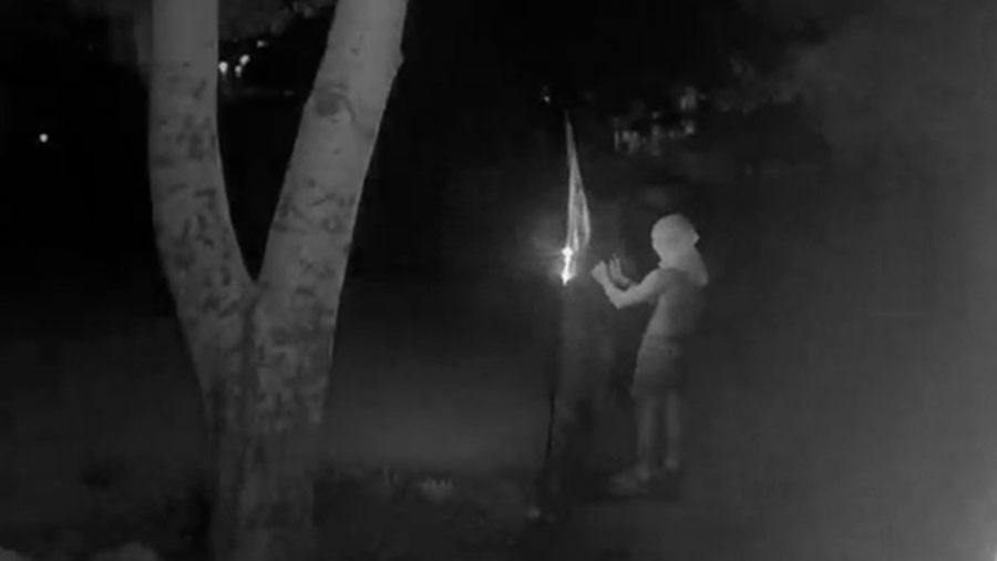 The suspects burning the Pride flag outside the Reynolds family (Courtesy: Reynolds family)...
