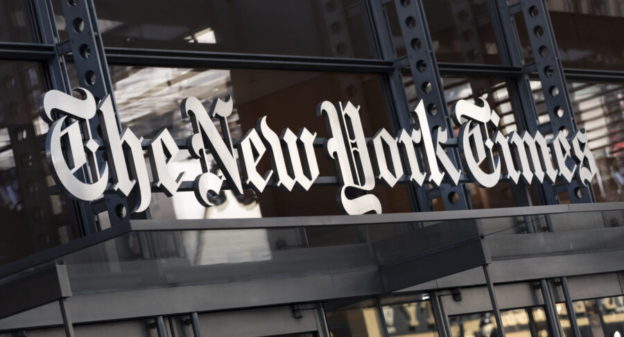 FILE - A sign for The New York Times hangs above the entrance to its building, May 6, 2021, in New ...