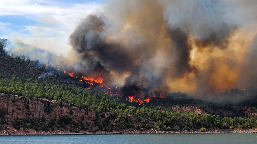flames and smoke at water of flaming gorge...