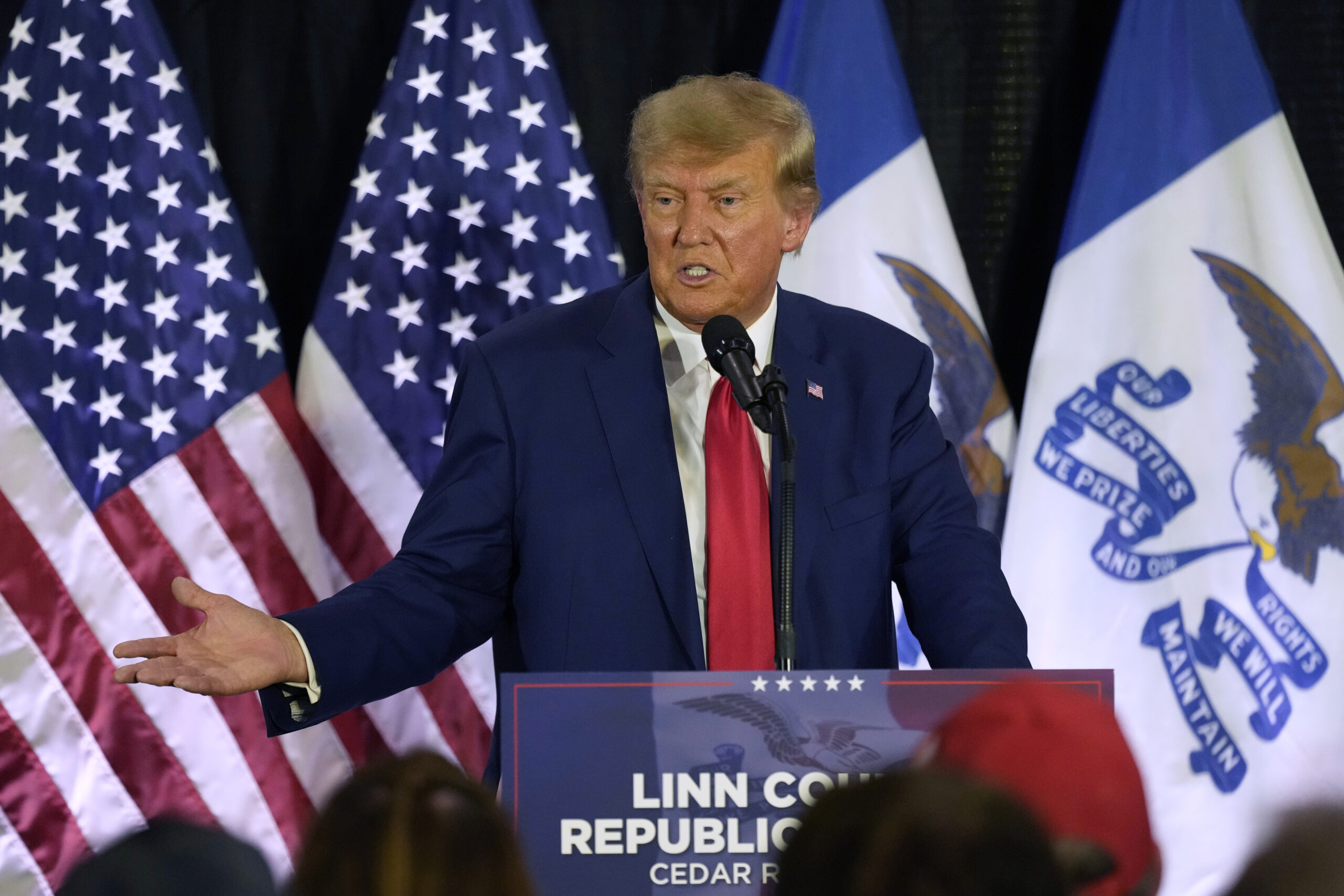 FILE - Former President Donald Trump speaks to campaign volunteers at the Elks Lodge, July 18, 2023...