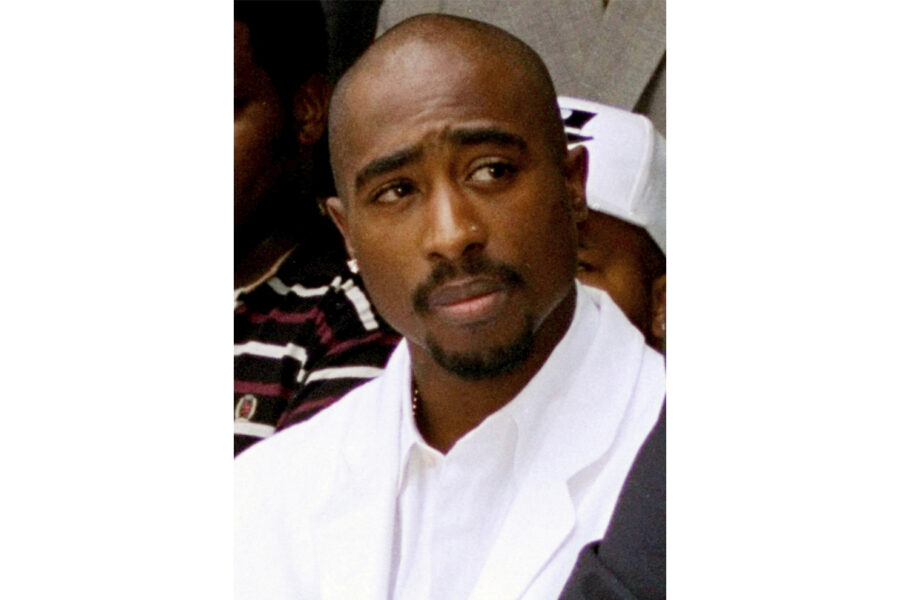 FILE - Rapper Tupac Shakur attends a voter registration event in South Central Los Angeles, Aug. 15...