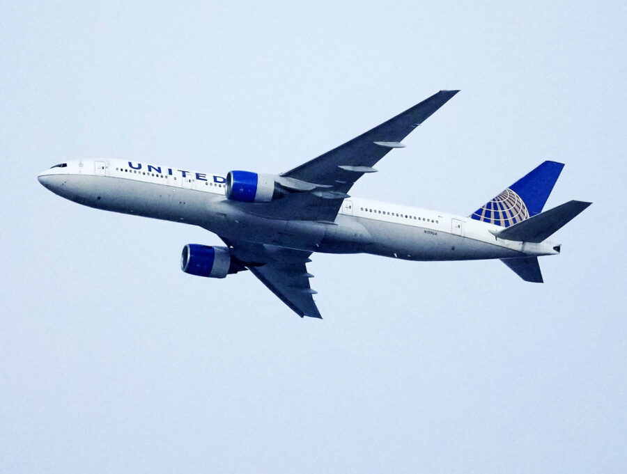 FILE - A United Airlines jetliner soars past an MLS soccer match July 8, 2023, in Commerce City, Co...