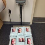 The bags of the blue pills being weighed on a scale. (Utah County Sherriff's Office)