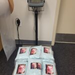 The bags of the blue pills being weighed on a scale. (Utah County Sherriff's Office)