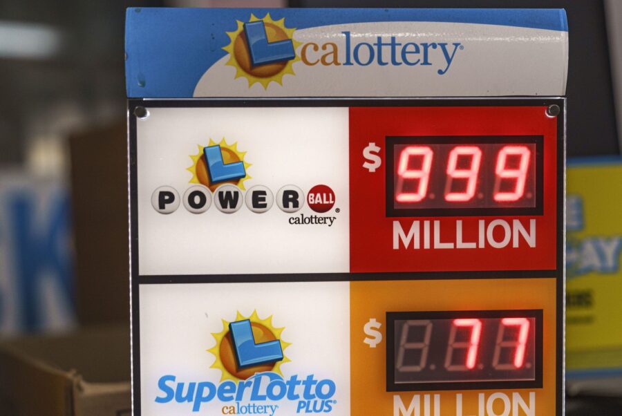 A California Lottery Powerball sign displays an amount of $999 million at Won Won Mini Market liquo...