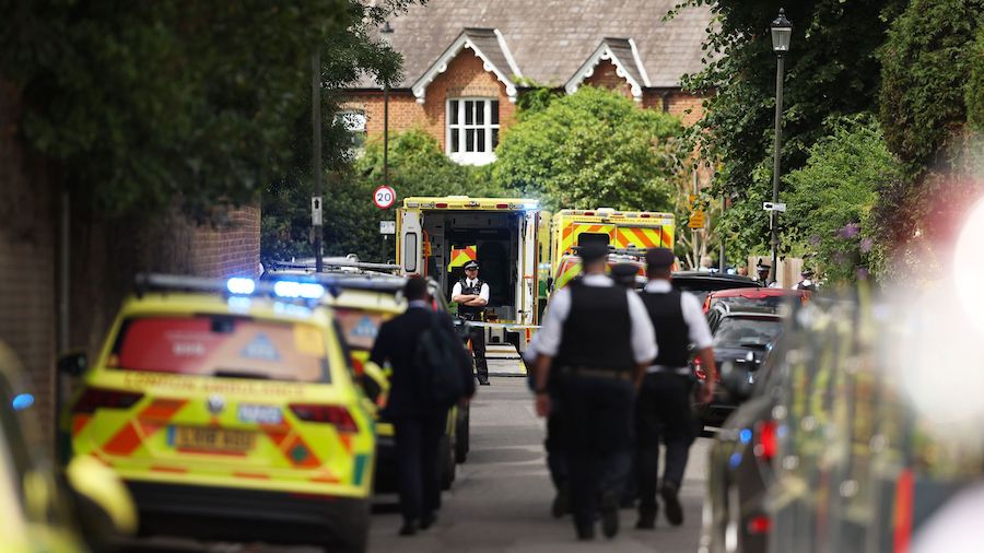 Police and emergency services attend the scene of the car crash on July 6, in Wimbledon, London. (J...