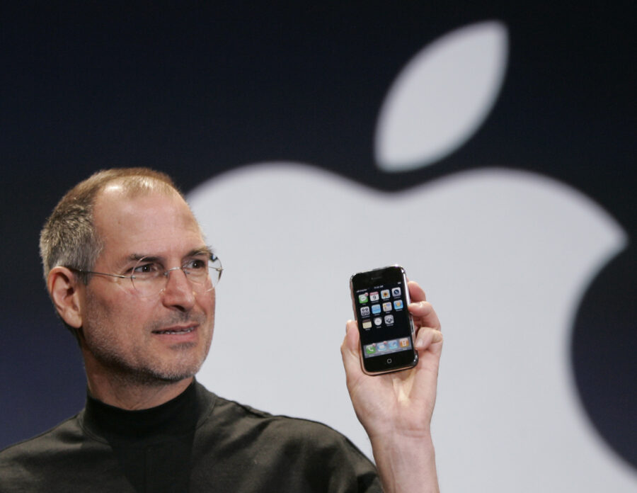 FILE - Apple CEO Steve Jobs holds up an Apple iPhone at the MacWorld Conference, Jan. 9, 2007, in S...