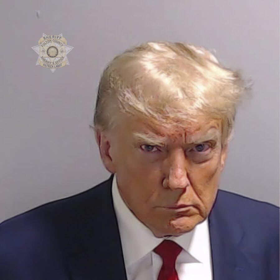 This booking photo provided by Fulton County Sheriff's Office, shows former President Donald Trump ...