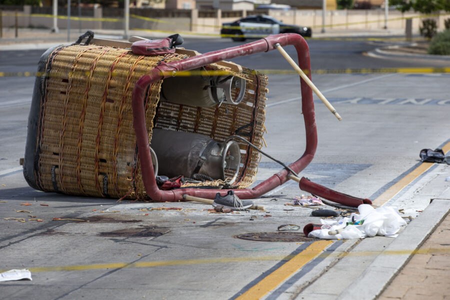 FILE - The basket of a hot air balloon lies on the pavement after a crash landing in Albuquerque, N...