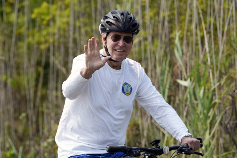 President Joe Biden rides his bike at Gordons Pond in Rehoboth Beach, Del., Tuesday, Aug.1, 2023. (...