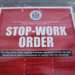 A stop work order is posted on the door of a Boston Market restaurant in Hackensack, N.J., Thursday, Aug. 17, 2023. State labor officials have temporarily shut down more than two dozen Boston Market restaurants in New Jersey after an investigation sparked by worker complaints found multiple violations of workers' rights, including more than $600,000 in back wages owed to 314 employees.(AP Photo/Seth Wenig)Credit: ASSOCIATED PRESS