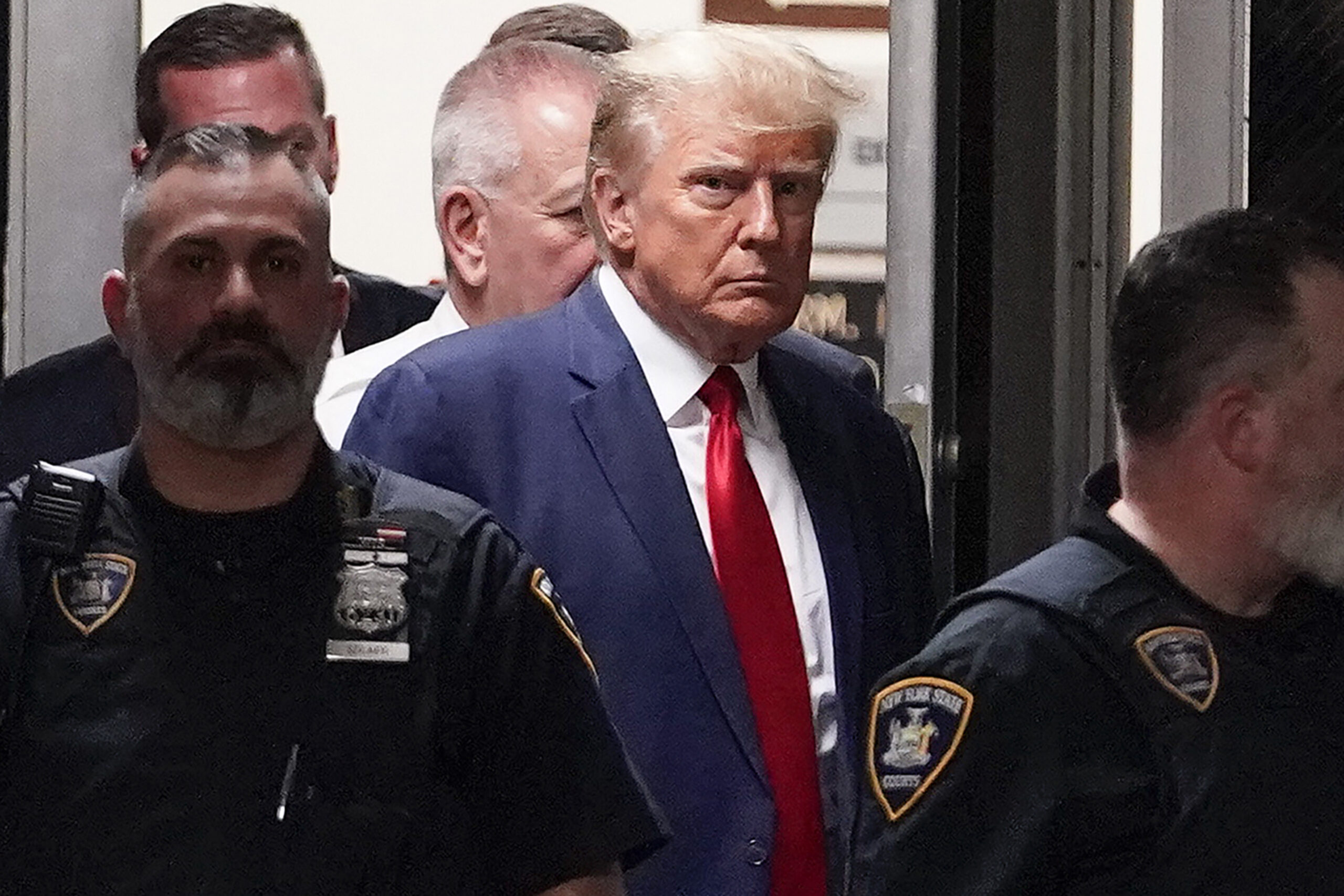 FILE - Former President Donald Trump is escorted to a courtroom, April 4, 2023, in New York. Donald...