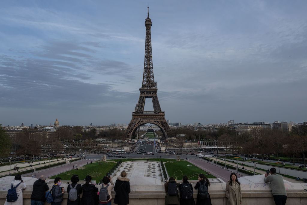 FILE: People gather at a popular Eiffel Tower viewing spot on March 29, 2023 in Paris, France. The ...