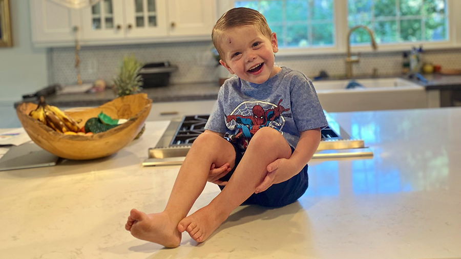 Boy smiling on counter...