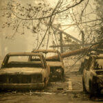 FILE - Abandoned cars, scorched by the wildfire, line Pearson Rd. in Paradise, Calif., on Saturday, Nov. 10, 2018. Currently, the Maui wildfires are the nation's fifth-deadliest on record, according to research by the National Fire Protection Association, a nonprofit that publishes fire codes and standards used in the U.S. and around the world. The Camp Fire killed 85 people and forced tens of thousands of others to flee their homes as flames destroyed 19,000 buildings in Northern California.(AP Photo/Noah Berger, File)Credit: ASSOCIATED PRESS