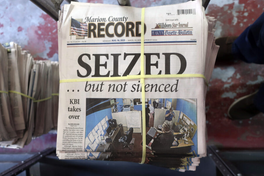 A stack of the latest weekly edition of the Marion County Record sits in the back of the newspaper'...