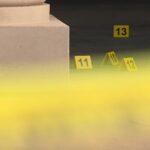 Crime scene tape and  evidence markers at Midtown 360 apartments. (KSL TV) 